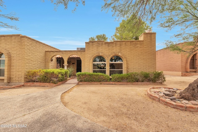 2435 N Shade Tree Cir, Tucson, AZ 85715 - view of front of home with a chimney