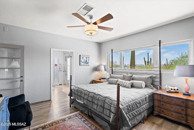 6731 N Pontatoc Rd, Tucson, AZ 85718 - bedroom with wood finished floors and a ceiling fan
