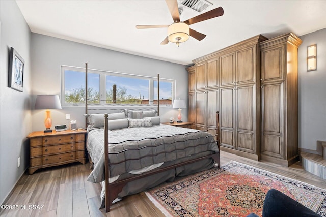 6731 N Pontatoc Rd, Tucson, AZ 85718 - bedroom featuring light wood-style floors, a ceiling fan, and baseboards