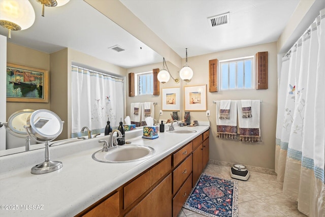 6731 N Pontatoc Rd, Tucson, AZ 85718 - bathroom featuring double vanity, tile patterned floors, and baseboards