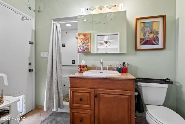 6731 N Pontatoc Rd, Tucson, AZ 85718 - full bathroom featuring toilet, vanity, tile patterned flooring, and ceiling fan