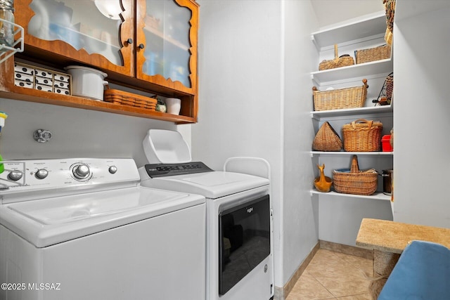 6731 N Pontatoc Rd, Tucson, AZ 85718 - laundry room with washer and clothes dryer, light tile patterned floors, and baseboards