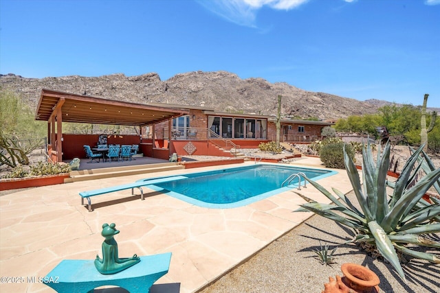 6731 N Pontatoc Rd, Tucson, AZ 85718 - view of swimming pool with a mountain view, outdoor dining area, a patio, and a diving board