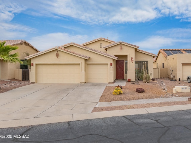 246 W Tabascoe Pl, Oro Valley, AZ 85755 - mediterranean / spanish home with stucco siding, an attached garage, concrete driveway, and a tile roof