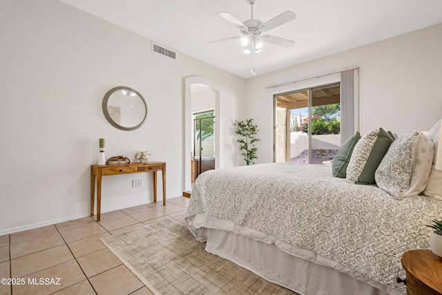 246 W Tabascoe Pl, Oro Valley, AZ 85755 - bedroom featuring access to outside, multiple windows, light tile patterned floors, and arched walkways