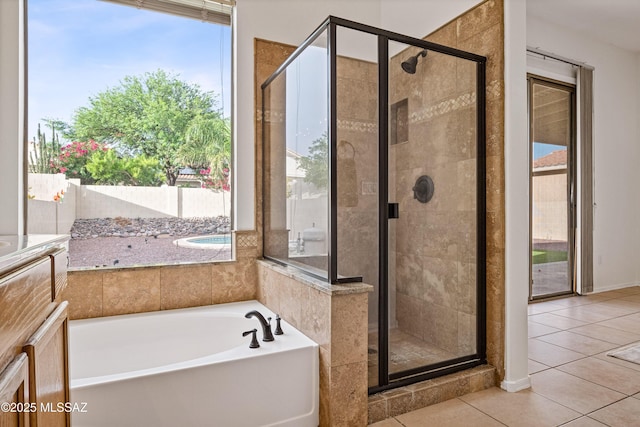 246 W Tabascoe Pl, Oro Valley, AZ 85755 - bathroom featuring tile patterned flooring, a bath, and a shower stall