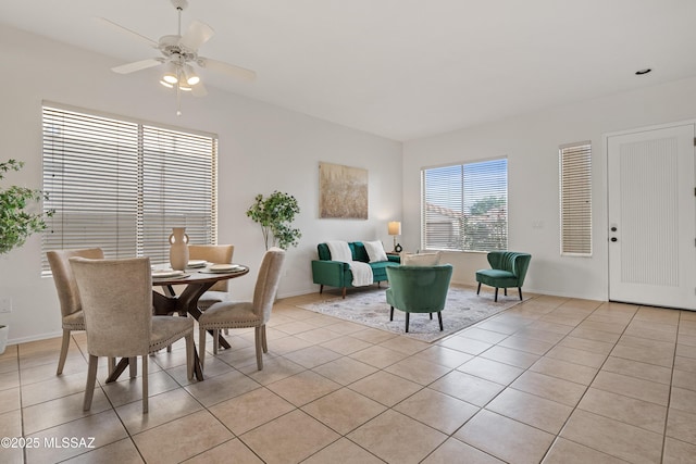 246 W Tabascoe Pl, Oro Valley, AZ 85755 - dining area with light tile patterned floors, a ceiling fan, and baseboards
