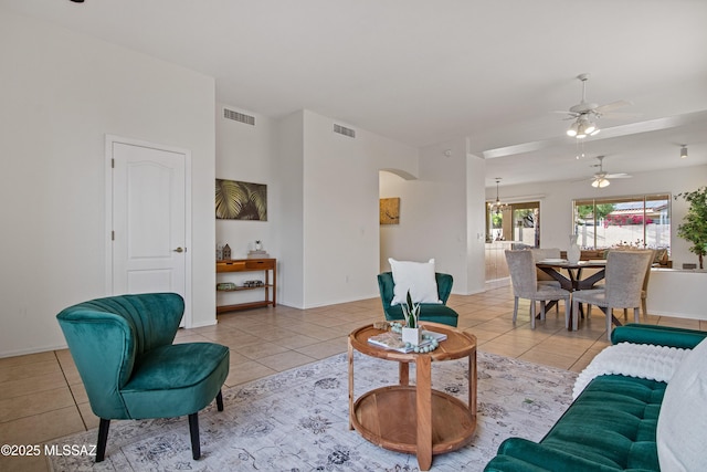 246 W Tabascoe Pl, Oro Valley, AZ 85755 - living area featuring tile patterned floors, a ceiling fan, a chandelier, and baseboards