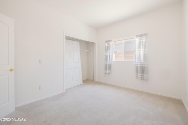 3347 S Desert Scroll Pl, Tucson, AZ 85735 - unfurnished bedroom with carpet floors, a closet, and baseboards