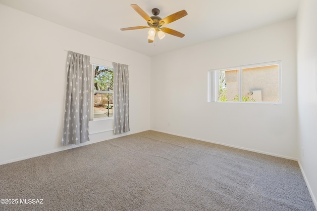 3347 S Desert Scroll Pl, Tucson, AZ 85735 - carpeted spare room featuring ceiling fan and baseboards