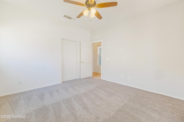 3347 S Desert Scroll Pl, Tucson, AZ 85735 - empty room with light carpet, a ceiling fan, and baseboards