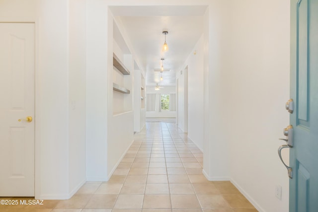 3347 S Desert Scroll Pl, Tucson, AZ 85735 - hall featuring light tile patterned floors, baseboards, and built in features