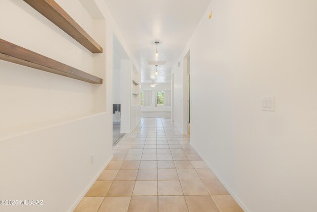 3347 S Desert Scroll Pl, Tucson, AZ 85735 - corridor featuring light tile patterned floors and baseboards