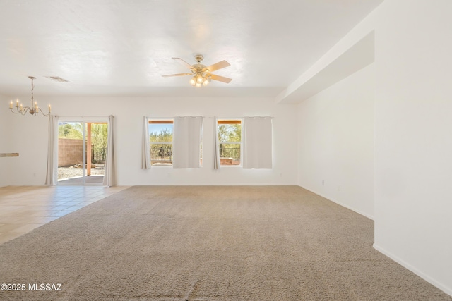 3347 S Desert Scroll Pl, Tucson, AZ 85735 - empty room with a chandelier, a ceiling fan, carpet floors, and baseboards