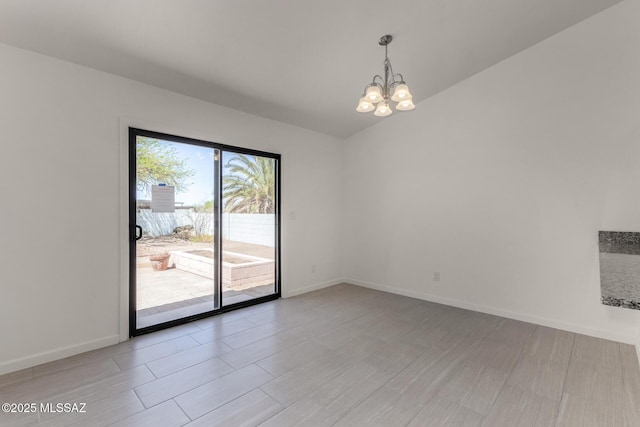 8072 S Carbury Way, Tucson, AZ 85747 - empty room with a chandelier, light wood finished floors, and baseboards