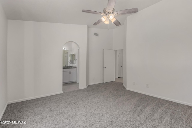 8072 S Carbury Way, Tucson, AZ 85747 - carpeted empty room with ceiling fan, baseboards, and arched walkways