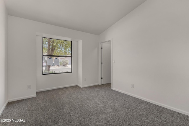 8072 S Carbury Way, Tucson, AZ 85747 - unfurnished room featuring carpet flooring, vaulted ceiling, and baseboards