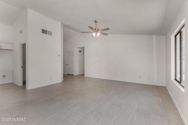 8072 S Carbury Way, Tucson, AZ 85747 - unfurnished living room with a ceiling fan, baseboards, light wood-type flooring, and high vaulted ceiling