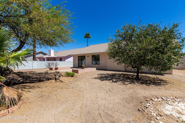 8072 S Carbury Way, Tucson, AZ 85747 - back of house with a tile roof, stucco siding, and a patio