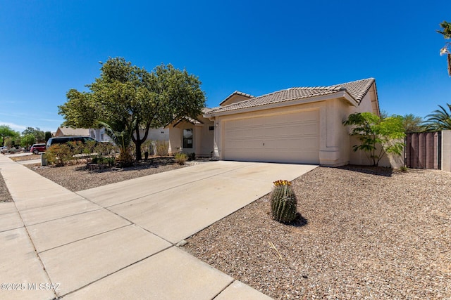 8072 S Carbury Way, Tucson, AZ 85747 - view of front of property featuring a tile roof, driveway, stucco siding, and a garage