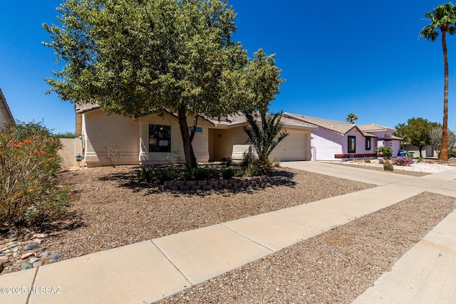 8072 S Carbury Way, Tucson, AZ 85747 - view of front of house with concrete driveway, stucco siding, and a garage