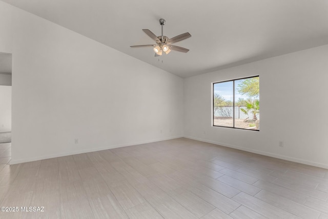 8072 S Carbury Way, Tucson, AZ 85747 - empty room with lofted ceiling, ceiling fan, light wood-type flooring, and baseboards