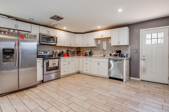3758 E Ellington Pl, Tucson, AZ 85713 - kitchen featuring appliances with stainless steel finishes, backsplash, a sink, light countertops, and recessed lighting