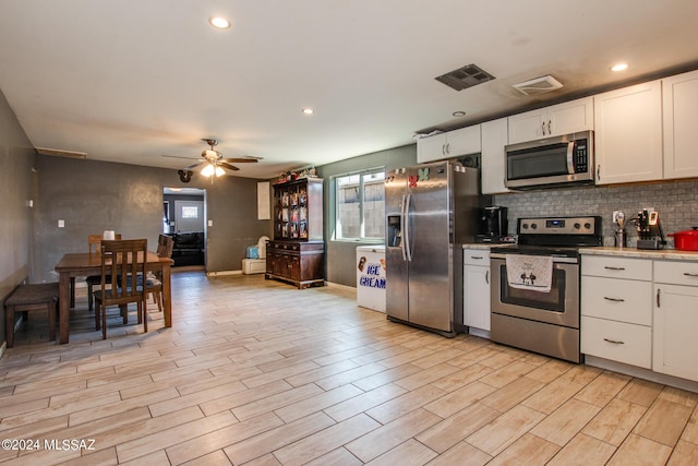 3758 E Ellington Pl, Tucson, AZ 85713 - kitchen featuring appliances with stainless steel finishes, healthy amount of natural light, decorative backsplash, ceiling fan, and recessed lighting