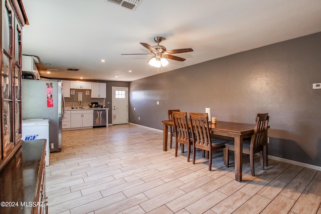 3758 E Ellington Pl, Tucson, AZ 85713 - dining area with a ceiling fan, light wood finished floors, baseboards, and recessed lighting