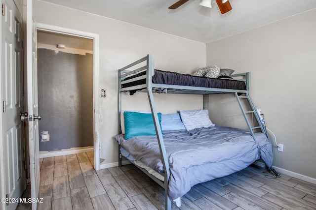 3758 E Ellington Pl, Tucson, AZ 85713 - bedroom with wood finish floors, baseboards, and ceiling fan