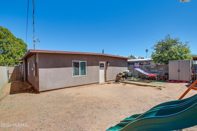 3758 E Ellington Pl, Tucson, AZ 85713 - back of property featuring stucco siding and a fenced backyard