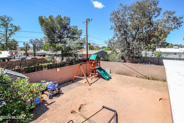 3758 E Ellington Pl, Tucson, AZ 85713 - fenced backyard featuring a playground