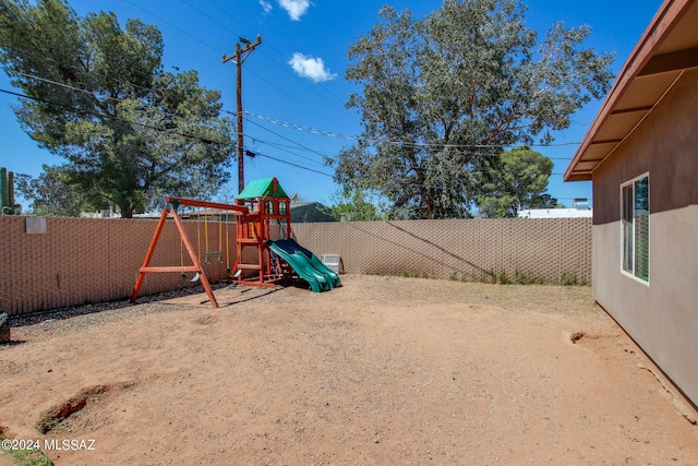 3758 E Ellington Pl, Tucson, AZ 85713 - fenced backyard featuring a playground
