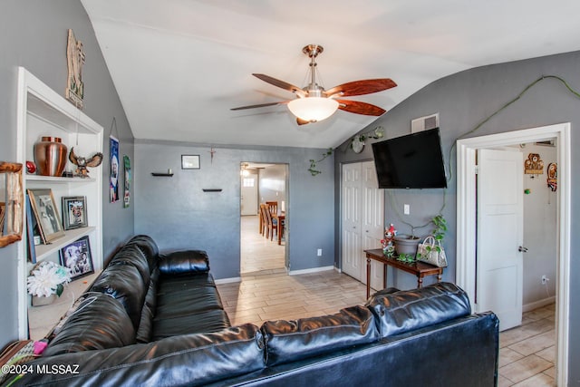 3758 E Ellington Pl, Tucson, AZ 85713 - living room with lofted ceiling, ceiling fan, and baseboards