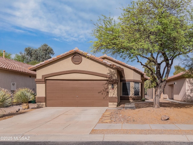 9504 N Englewood Dr, Tucson, AZ 85743 - view of front of house featuring stucco siding, a garage, concrete driveway, and a tile roof