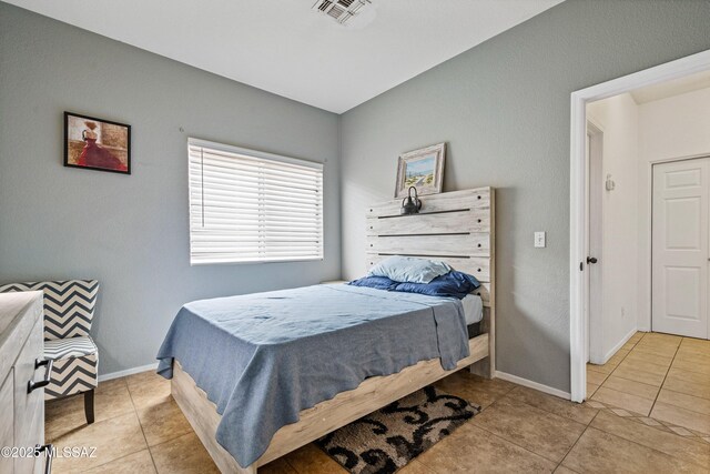 9504 N Englewood Dr, Tucson, AZ 85743 - tiled bedroom featuring baseboards