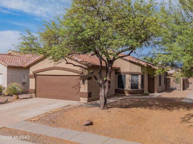 9504 N Englewood Dr, Tucson, AZ 85743 - mediterranean / spanish-style house with a garage, stucco siding, driveway, and a tile roof