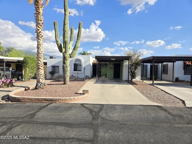 1358 S Desert Meadows Cir, Green Valley, AZ 85614 - view of front of property featuring driveway and stucco siding