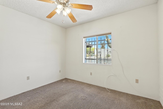1358 S Desert Meadows Cir, Green Valley, AZ 85614 - carpeted spare room featuring a textured ceiling and a ceiling fan