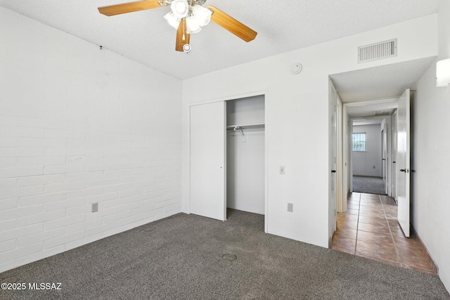 1358 S Desert Meadows Cir, Green Valley, AZ 85614 - unfurnished bedroom featuring carpet floors, a closet, and a ceiling fan