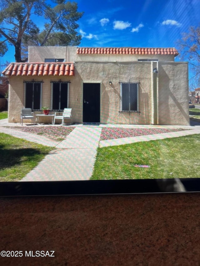 6640 E Calle Lapaz Unit A, Tucson, AZ 85715 - mediterranean / spanish house with a tile roof and stucco siding