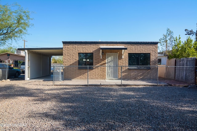 1321 W Saint Clair St, Tucson, AZ 85745 - view of front of house featuring an attached carport and gravel driveway