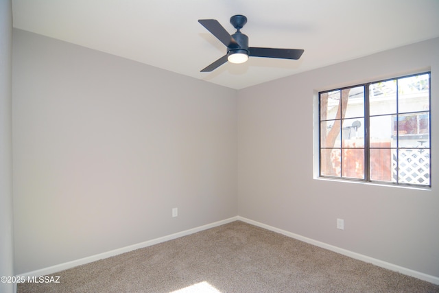 1321 W Saint Clair St, Tucson, AZ 85745 - spare room featuring carpet flooring, baseboards, and a ceiling fan