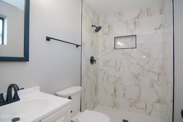 1321 W Saint Clair St, Tucson, AZ 85745 - bathroom with vanity, toilet, and a tile shower