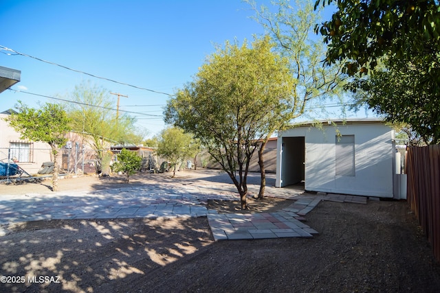 1321 W Saint Clair St, Tucson, AZ 85745 - fenced backyard with a patio area and an outdoor structure