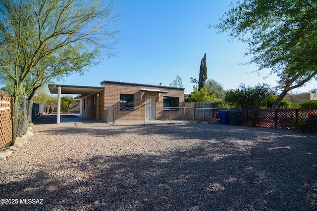 1321 W Saint Clair St, Tucson, AZ 85745 - back of house featuring brick siding and a gate