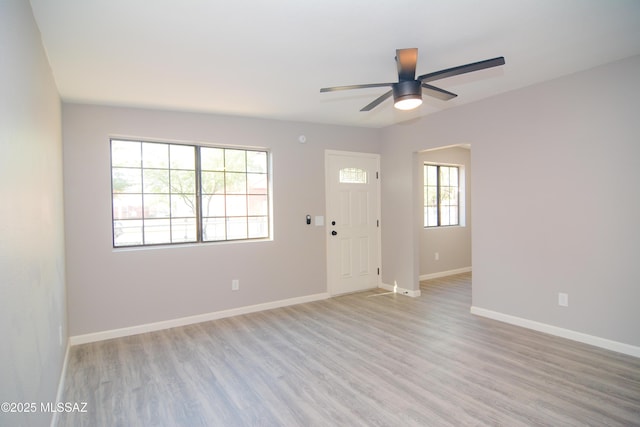 1321 W Saint Clair St, Tucson, AZ 85745 - foyer entrance with light wood-style flooring, a ceiling fan, and baseboards