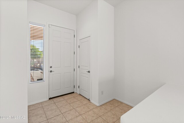 215 E Placita Lago Del Mago, Sahuarita, AZ 85629 - foyer entrance featuring light tile patterned flooring and baseboards