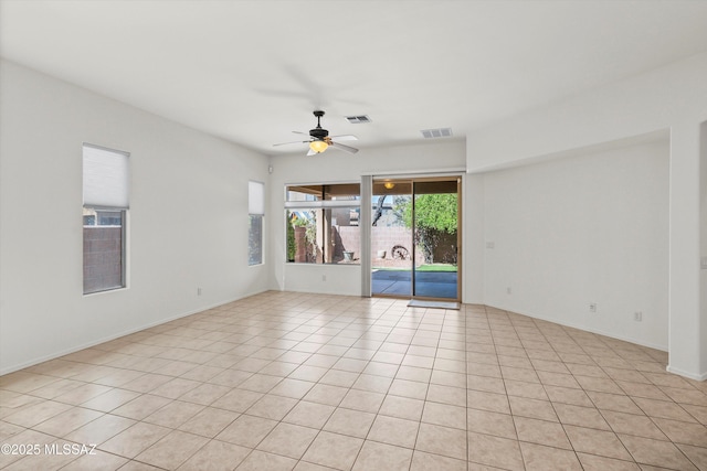 215 E Placita Lago Del Mago, Sahuarita, AZ 85629 - empty room featuring a ceiling fan and light tile patterned floors