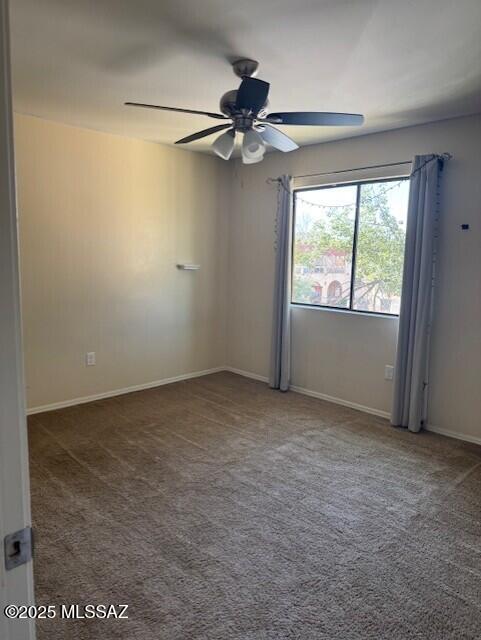6301 N Barcelona Ct Unit 1010, Tucson, AZ 85704 - empty room with a ceiling fan, carpet, and baseboards
